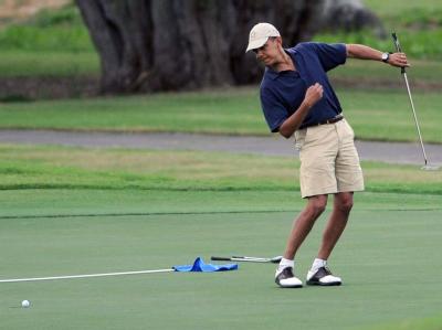 Sportlicher US-Präsident: Barack Obama mit Golf-Schläger. Barack Obama