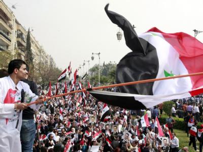 Anhänger des Assad-Regimes bei einer Demonstration in Damaskus. Foto: Youssef Badawi Pro-Assad-Demo