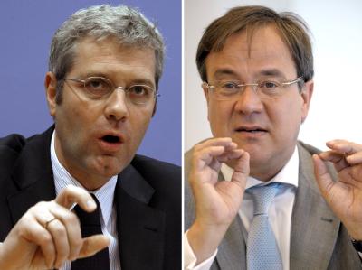 Bundesumweltminister Norbert Röttgen (l) will im Machtkampf um die Spitze der nordrhein-westfälischen CDU gegen Armin Laschet antreten. Röttgen und Laschet