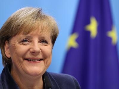 Strahlende Bundeskanzlerin: Euro-Staaten und Banken einigten sich auf einen teilweisen Schuldenerlass für Griechenland Foto: Oliver Berg Angela Merkel