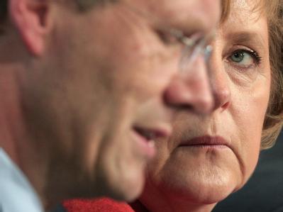 Christian Wulff und Angela Merkel. Foto: Johannes Eisele Wulff und Merkel