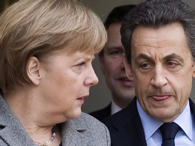 Not macht erfinderisch: Nach der gescheiterten Idee eines Sparkommissars für Griechenland soll es nach dem Willen von Merkel und Sarkozy nun ein Sperrkonto richten, damit Investoren ihr Geld wiedersehen. Foto: Ian Langsdon Merkel und Sarkozy