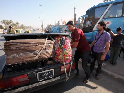 Flucht aus Syrien: Iraker, die vor der Gewalt aus ihrem eigenen Land geflohen sind, machen sich wieder auf die Suche nach einem sicheren Ort. Foto: Ali Abbas Flucht aus Syrien