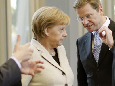 Bundeskanzlerin Angela Merkel und FDP-Chef Guido Westerwelle bei ihrem Treffen in Berlin. Koalitionsverhandlungen in Berlin