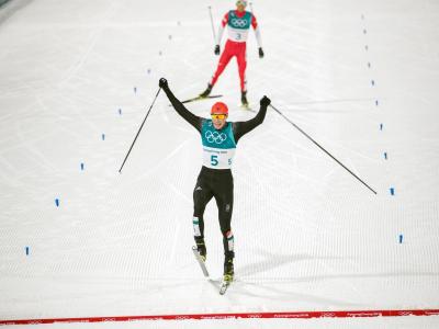 Eric Frenzel lief als Erster über die Ziellinie. Foto: Daniel Karmann Zieleinlauf