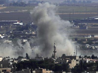 Rauch über der syrischen Stadt Ras al-Ain: Die Kurdenmilizen haben die wichtige Grenzstadt zurückerobert. Ras al-Ain