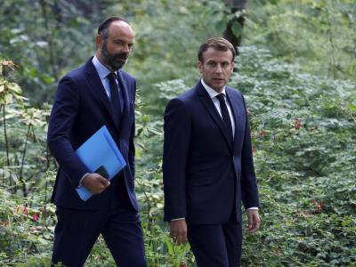 Frankreichs Präsident Emmanuel Macron (r) hat sich zu einer Volksabstimmung über Klimafragen bereit erklärt. Klimapolitik in Frankreich